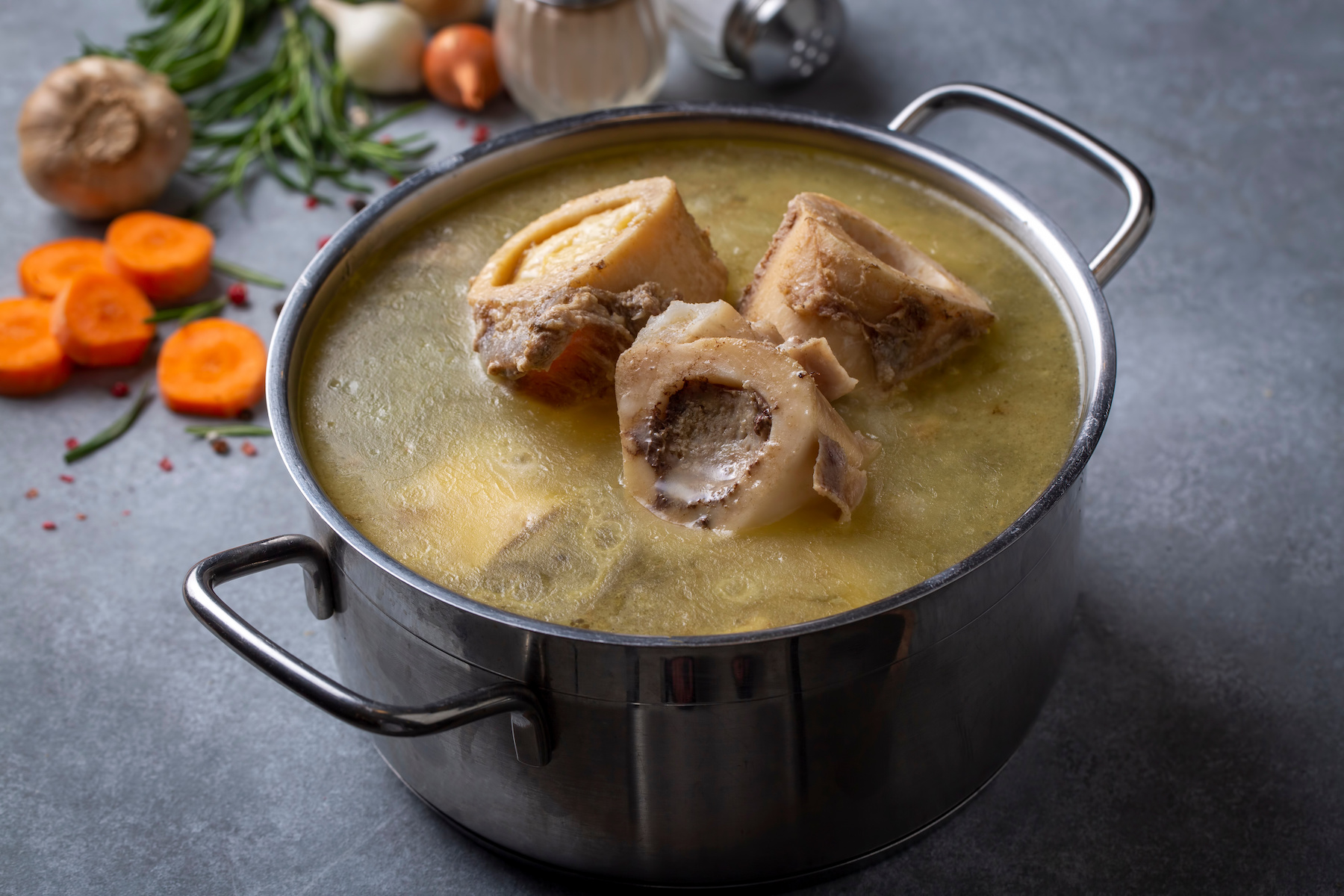 Boiled bone and broth. Homemade beef bone broth is cooked in a pot on. Bones contain collagen, which provides the body with amino acids, which are the building blocks of proteins. Beef Bone Broth 16oz - Image 1